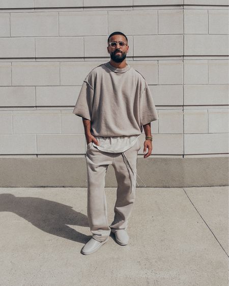 FEAR OF GOD Overlapped 3/4 Sleeves sweatshirt worn inside out (size M) and California slides in ‘Concrete’ (size 41). FEAR OF GOD x BARTON PERREIRA glasses in ‘Matte Taupe’. ESSENTIALS Smoke grey relaxed sweatpants (size M). An elevated casual men’s look. Linked items currently upto 50% off on sale. 

#LTKmens #LTKstyletip #LTKsalealert