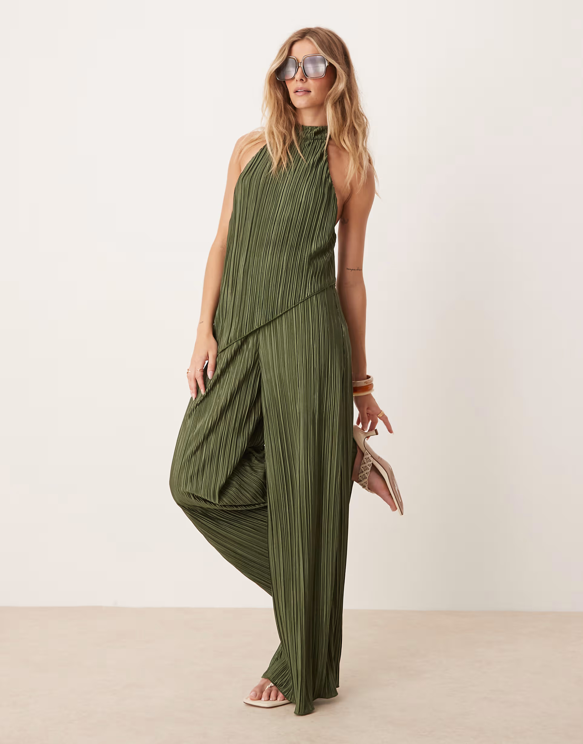 ASOS DESIGN plisse halter neck wide leg jumpsuit in khaki green | ASOS (Global)