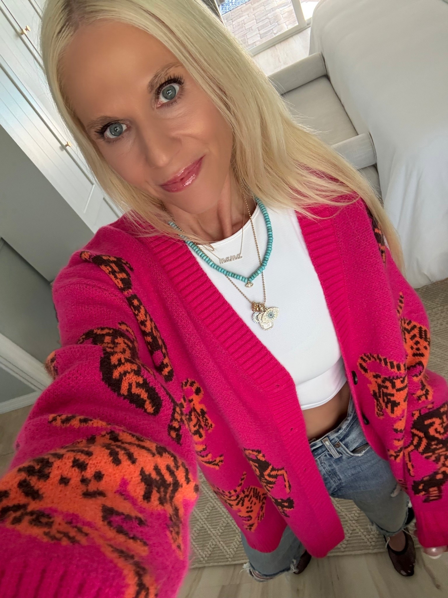 Love this bright pink leopard cardigan by Avara. It’s so fun. I paired it with a crop tank & AGOLDE 90s jeans for a relaxed look. Runs oversized for sure but that’s ok it adds to the look. I’m in XS. 

#LTKstyletip #LTKover40