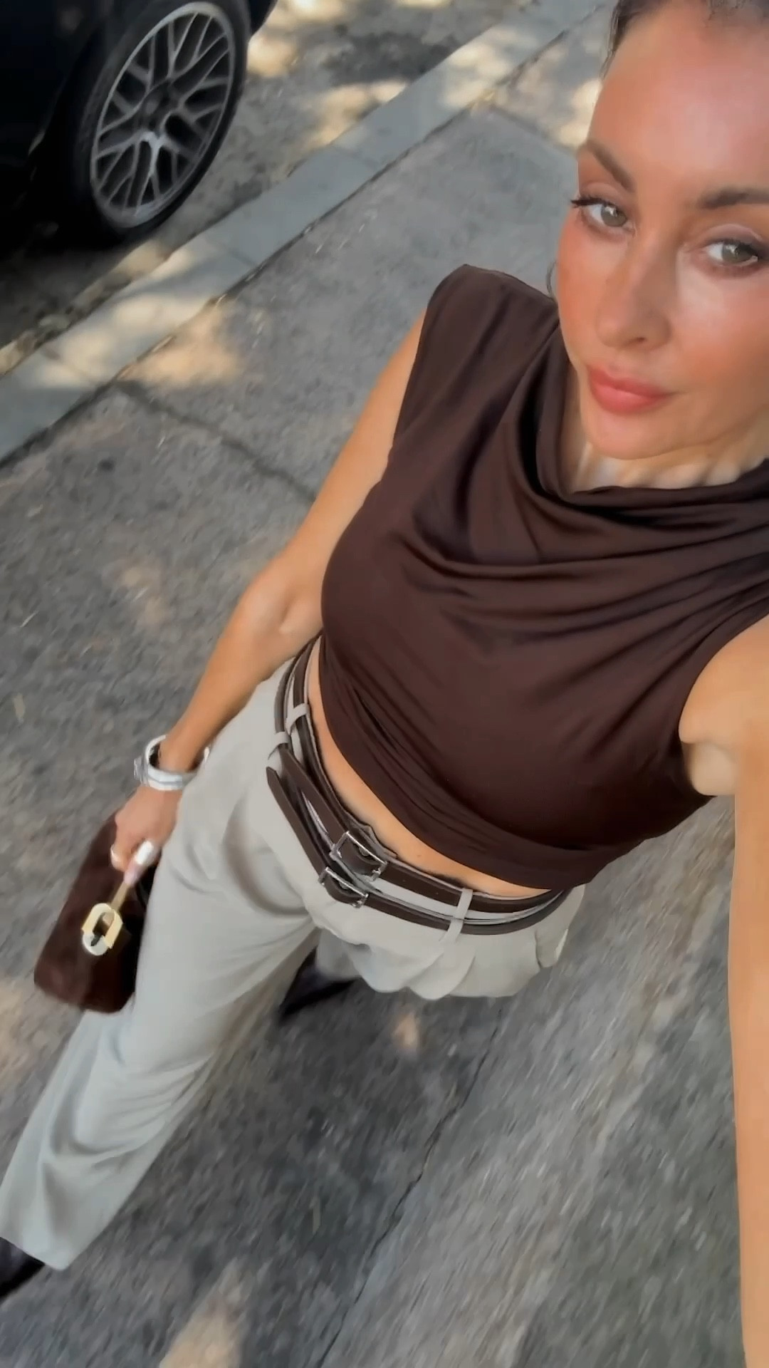Staples that standout 🤎  I always look for twists on classic pieces. This double belt trouser is just that. Runs slightly small (I’m wearing size small). How good is this rich chocolate top with shoulder details. It’s longer and can be tucked in (I folded it under for a cropped look). Also! Chocolate suede with gold hardware is so chic. Love the size for day to night. Also comes with a shoulder strap.  

#LTKSeasonal #LTKSaleAlert #LTKWorkwear