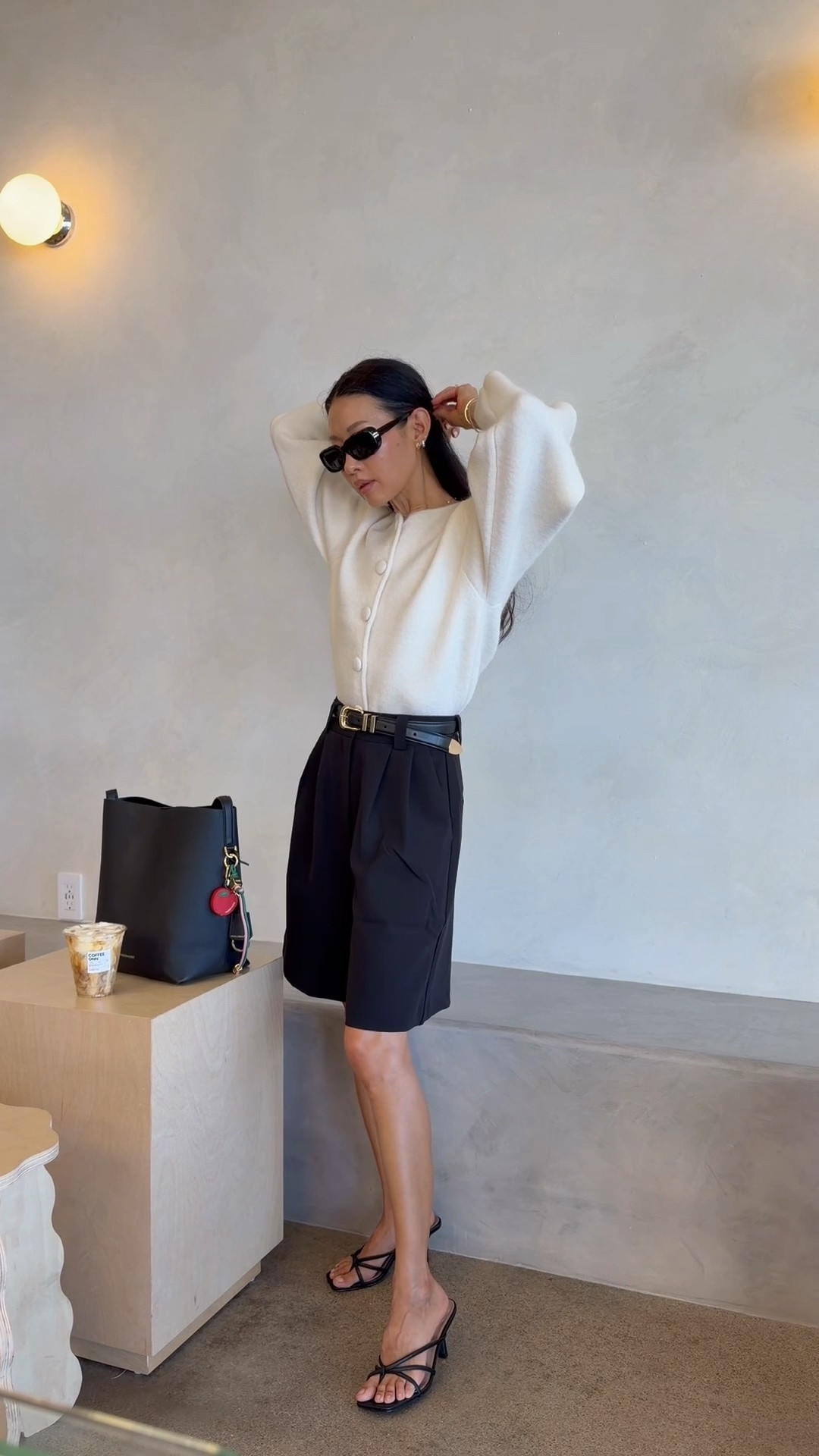 Fall transition outfit for a chic and elevated look. Loving the classy Bermuda shorts with the cream cardigan and bucket tote.

Wearing xxs in sweater and xxs in shorts.

#LTKootd #LTKOver40 #LTKWorkwear