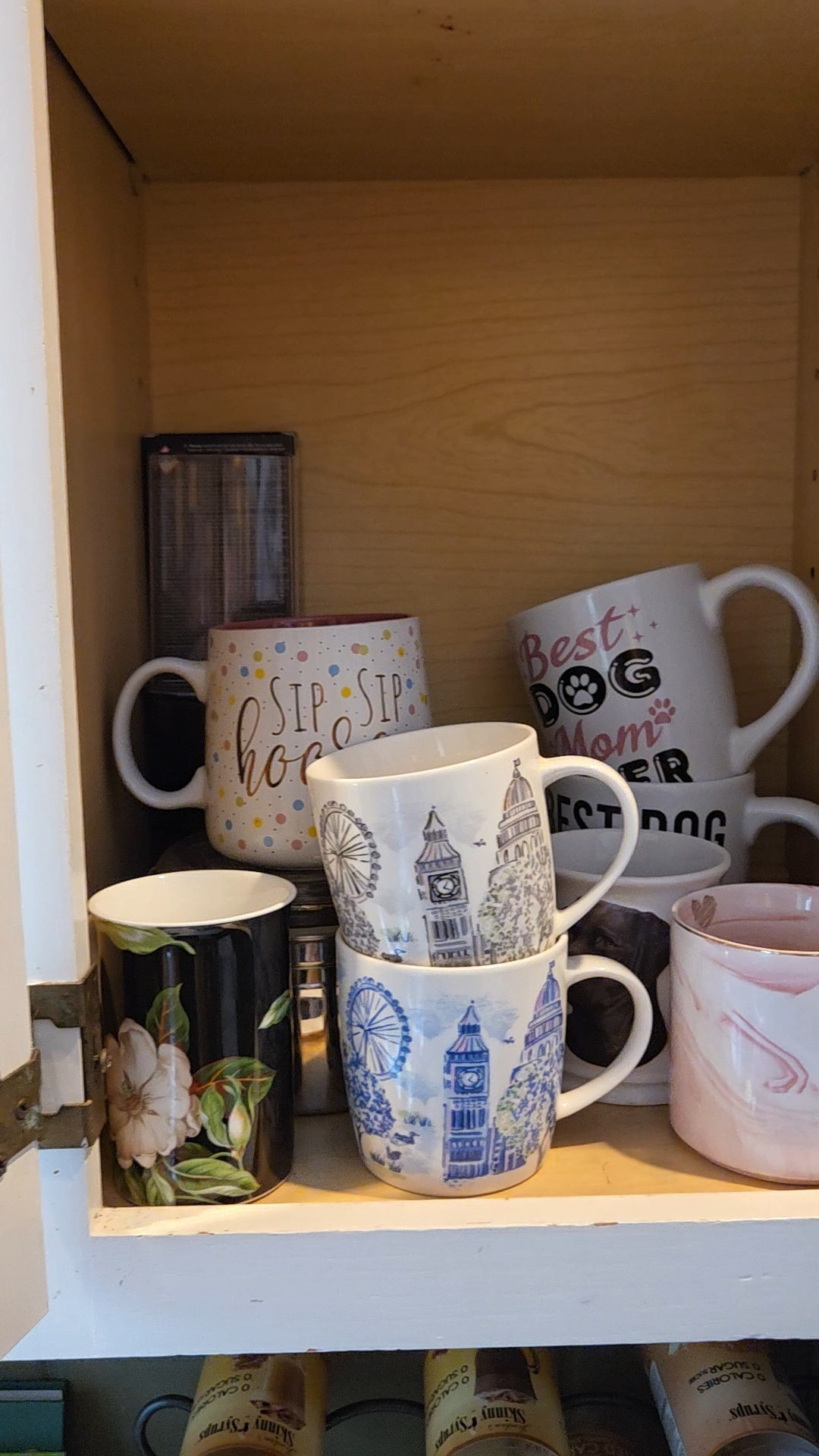 as much as I hate the trend of decanting everything from packaging into plastic I have to admit the risers in a cabinet will help desperately because my Jenga mug stack is not working and trust me when I say this is the paired down look