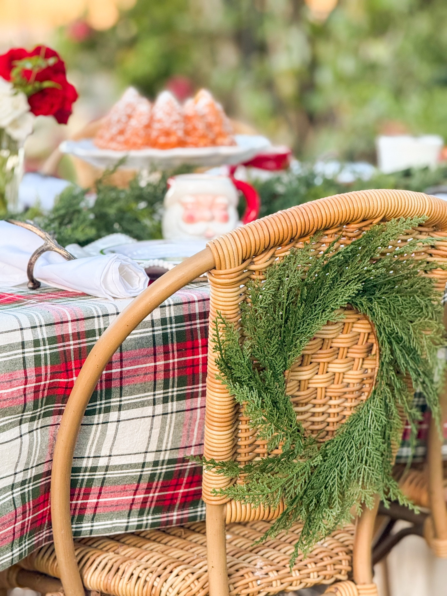 I love adding mini holiday wreaths to the back of my dining chairs! They really make a statement and are sure to wow your guests! This charming holiday tablescape is one of my favorites! I love this classic tartan plaid tablecloth, these Santa mugs, my pretty faux holiday garland, this fabulous Christmas tree cake and more! Everything is from @wayfair and is sure to be favorites for years to come! #wayfairpartner #wayfair #paidlinks #onlyatwayfair ❤️🎄 

#LTKParties #LTKHome #LTKHoliday