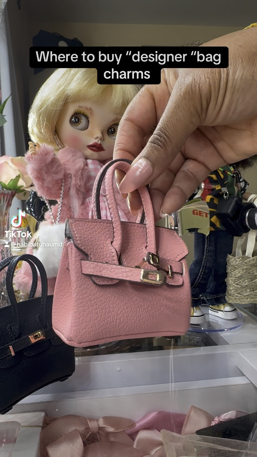 Where to buy bag charms. “Designer” bag charms are all the rage! I use them as doll props but also on my bags. 
They are so cute and let’s face it most of us will not be buying a real Birkin bag any time soon. 
I have also shown popular cherry charms made popular by coach. The authentic cost $95 & the alternatives which look exactly the same ( except for the lack of the tiny coach logo) cost under $20 
Have fun decorating your bags. 

#LTKFindsUnder100 #LTKSaleAlert #LTKItBag