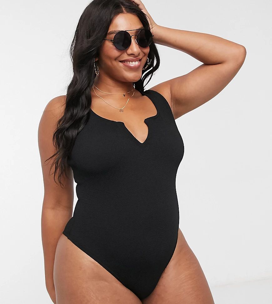 ASOS DESIGN curve crinkle notch front swimsuit in black | ASOS (Global)