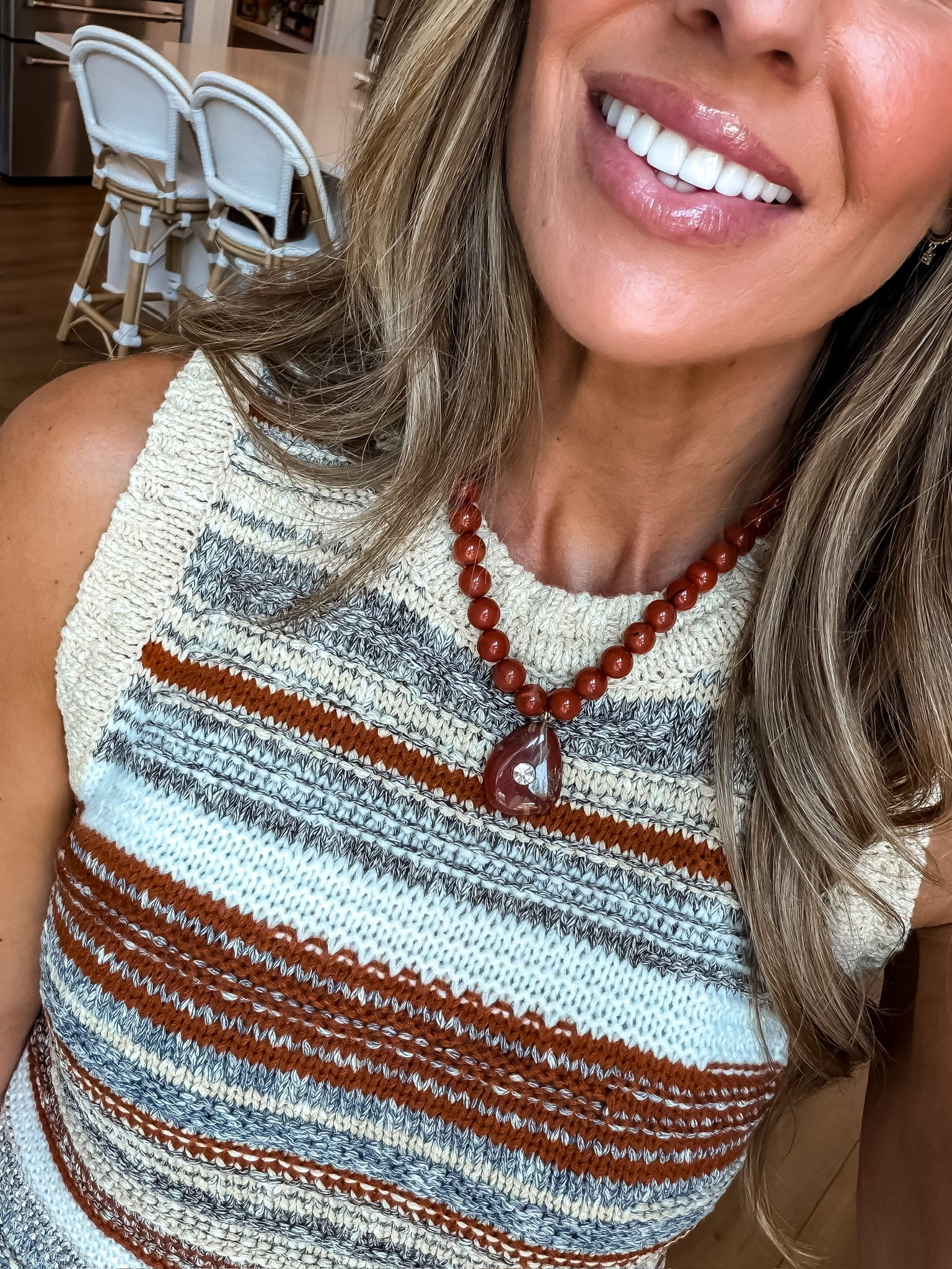 This striped knit tank is such a good way to start bringing fall colors into the mix while it’s still hot out. I love the mix of cream, rust and gray, and the chunky beaded necklace pulls out those warmer tones without making the outfit feel heavy.

striped knit tank, fall transition outfit, sleeveless sweater, rust tones, neutral outfit, statement necklace, layered jewelry, early fall style, women’s fashion, transitional fashion, TheMomInStyle

#LTKootd #LTKSeasonal #LTKOver40