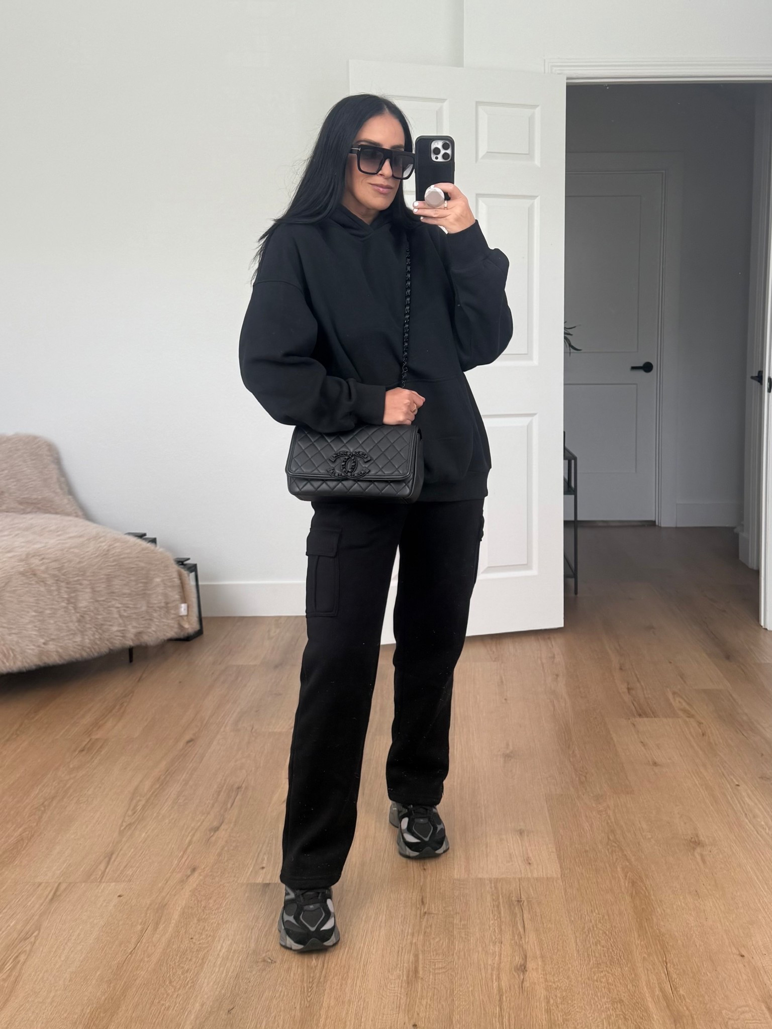 Women’s oversized hoodie wearing size medium. BLack fleece-lined cargo sweatpants, wearing size medium. 