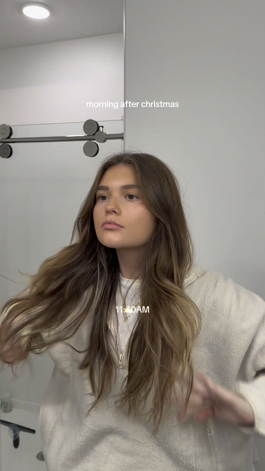 Diamond rug, white bed, black tv console, wood coffee tablee