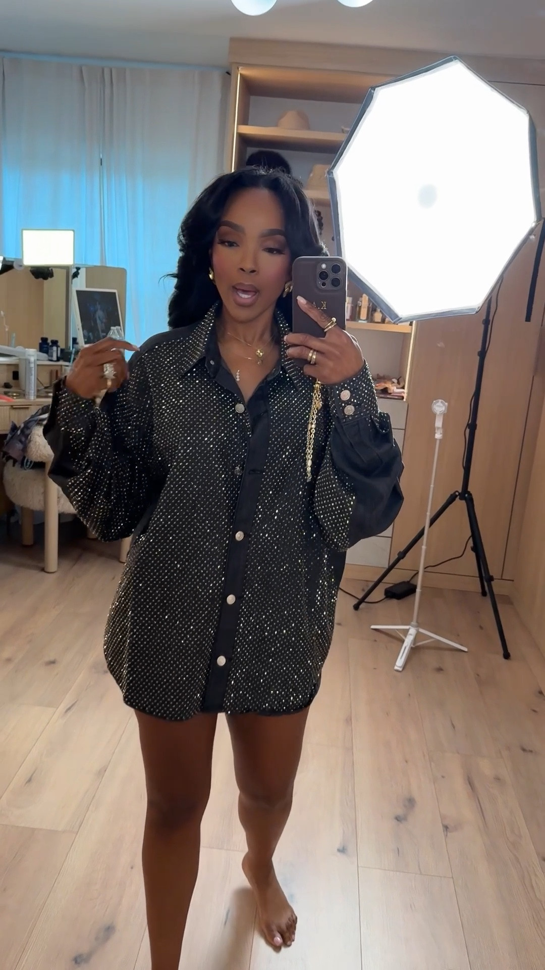 Cost per wear on this @Akira statement shirt keeps dropping because it doubles as a top, mini dress, or layering piece — one bold item, endless outfit options. The subtle sparkle elevates it instantly while the relaxed fit keeps it effortless and wearable.

This is one of those pieces that does the most with minimal styling. Throw on heels and a clutch for nights out, or layer it over denim or trousers when you want an elevated casual look. A true long-term shopping strategy piece.

Perfect for dinners, girls’ night, birthday looks, events, or styled down for elevated everyday wear.

📏 Sizing:
Shirt: Small  

Measurements: 5’4” · 138 lbs · 34D · 27” waist · 40” hips

Statement shirt outfit, sparkly top styling, Akira outfit inspo, elevated night out look, versatile wardrobe staple, cost per wear fashion, chic layering piece.

Follow me on Instagram and YouTube @kirasfashionfinds

#LTKgrwm #LTKootd