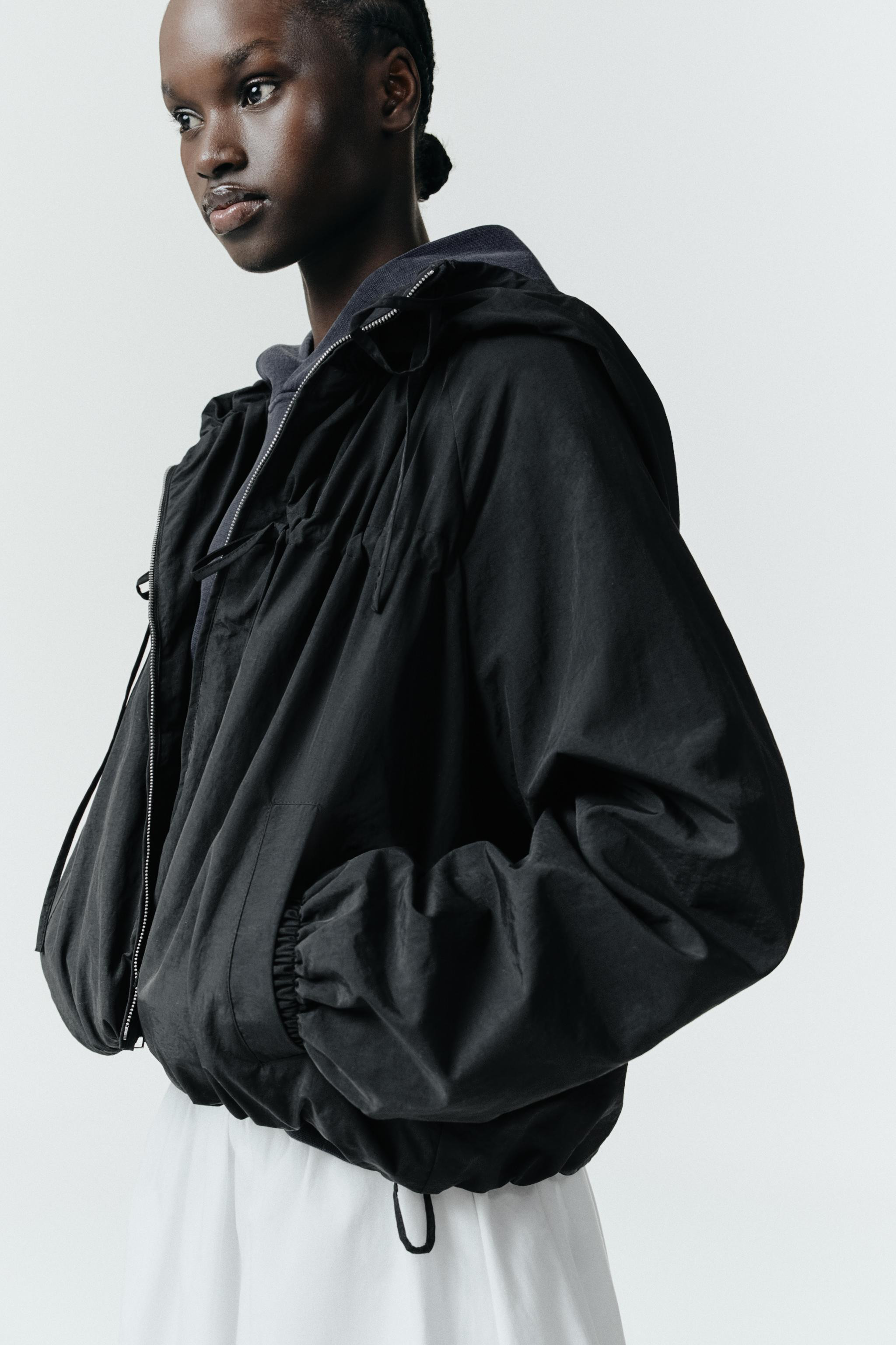 High-neck jacket with an adjustable hoodie. Long sleeve with elastic cuffs. Side pockets with sna... | Zara AU