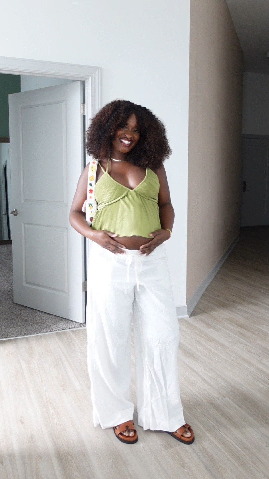 Pregnant/Maternity ootd - halter top, white linen pants, Hermes sandal dupes, Tommy bead bag

#LTKVideo #LTKBump #LTKStyleTip