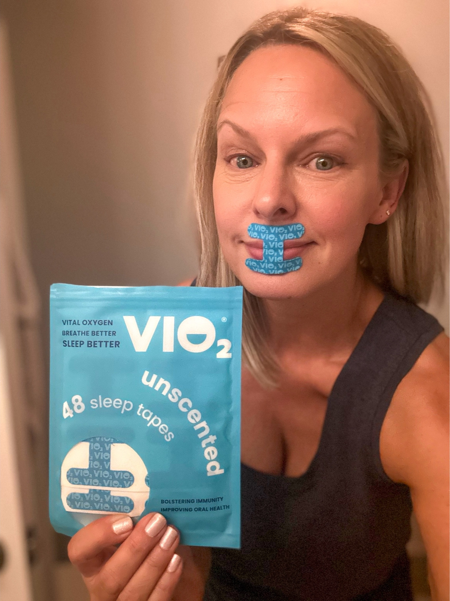 I know. It looks a little weird, but I love it! Mouth taping…have you heard of it? 
Here’s why I do it every single night…

"Nasal breathing promotes better oral and jaw muscle tone."  - Today Show

"Improve sleep quality by reducing snoring, dry mouth, and sleep apnea." - Good Morning America

This small, safe and easy to use mouth trainer was created by a doctor and helps promote nasal breathing to better your sleep, bolster immunity and improve oral health (no more gross dry mouth) 

By simply taping your mouth shut and breathing through your nose, you can sleep better and increase your oxygen intake which is beneficial in so many ways! 