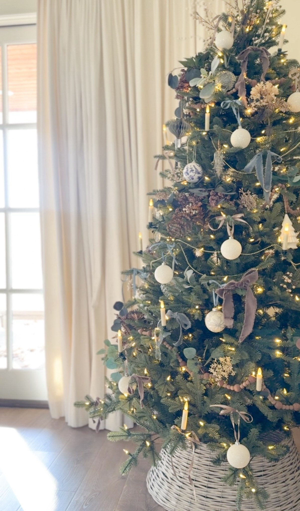 A look at our bedroom tree ✨ This is our second year with this Balsam Hill tree from Lowe’s and it truly is the easiest setup I’ve ever had. The lights connect through the center poles, so no extra cords to fuss with—and it requires zero fluffing!

Since our bedroom already leans into blue tones, I stayed within that palette and mixed in some of our fall florals in soft plum for depth. I added white and glass baubles along with a few clip-on candles for that cozy glow. It all feels calm, classic, and just a touch moody for winter. 💙🎄

#LTKHome #LTKHoliday #LTKSeasonal