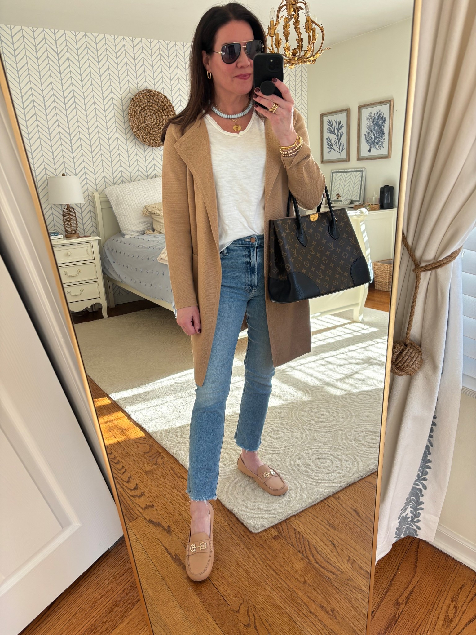 Love this look pairing a simple white tee with a long, open cardigan. Perfect for warmer spring days when you don’t want a coat! 