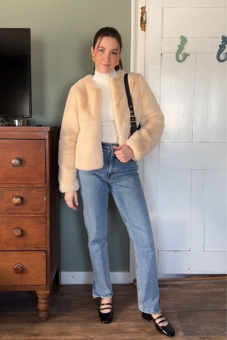 Winter outfit with fuzzy cream colored jacket, turtleneck sweater, light wash jeans, and flats 

#LTKSeasonal