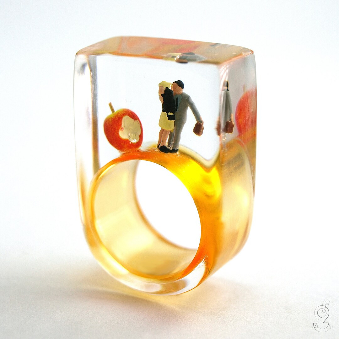 Warm-hearted Paradisiacal Lovers Ring With Kissing Mini Figures Next to an Apple on an Orange Rin... | Etsy (US)