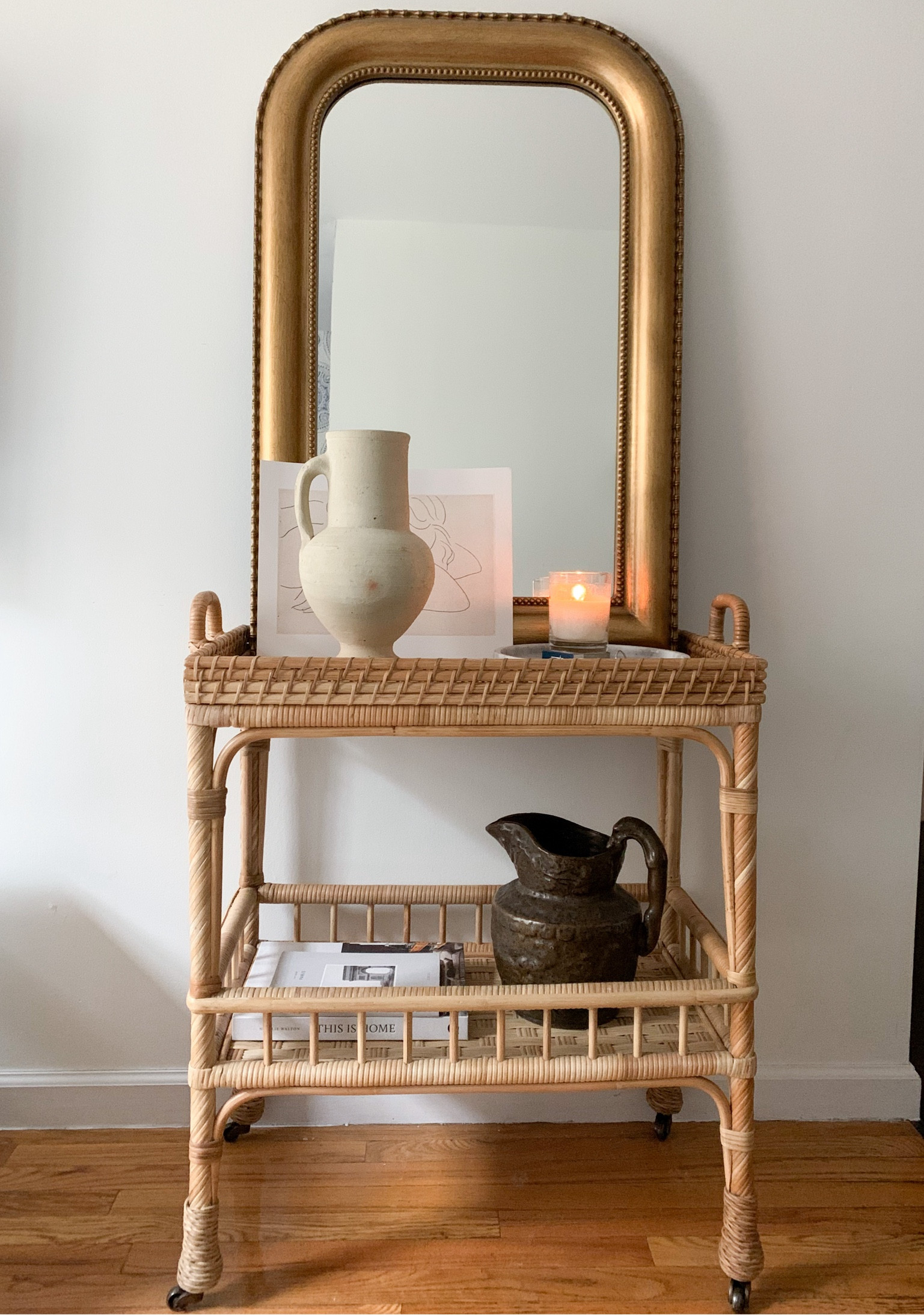 A little rattan cart vignette in the West Village with vintage ceramic and pottery. 

#LTKHome #LTKSeasonal