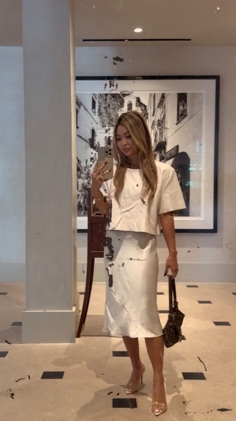 Easy uniform: Vegan leather top over a neutral Slip dress