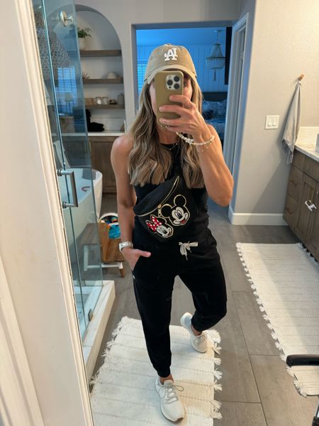 Travel outfit- headed to Disney world. Wearing my favorite Vuori joggers and target tank. Coziest sneakers for long days in the parks and how stinkin’ cute is my Mickey & Minnie crossbody bag? 🥰🥰

#LTKOver40 #LTKShoeCrush #LTKTravel