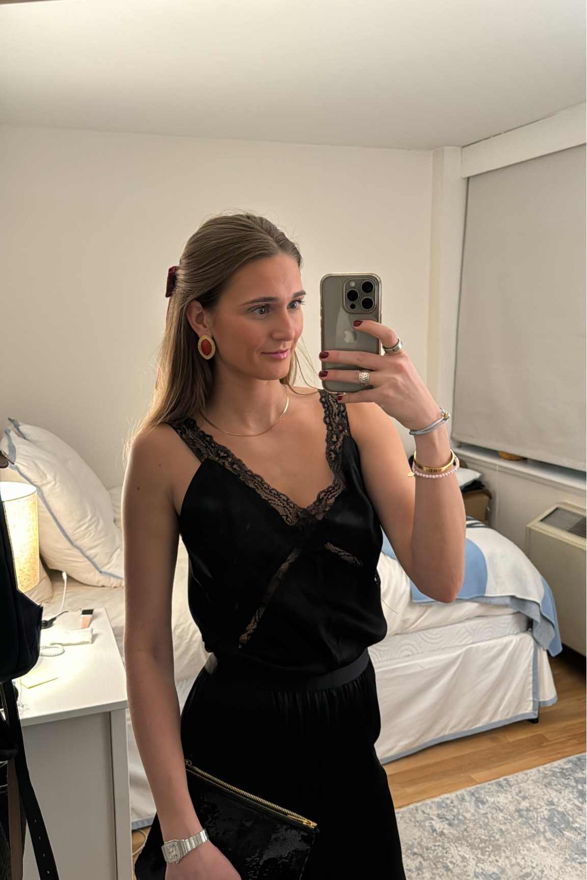 Going Out Outfit. Black silk lace jumpsuit with red earrings and a bow. On super sale - under $150

#redearrings #blackjumpsuit #laceoutfit 

#LTKfindsunder100 #LTKSpringSale #LTKstyletip