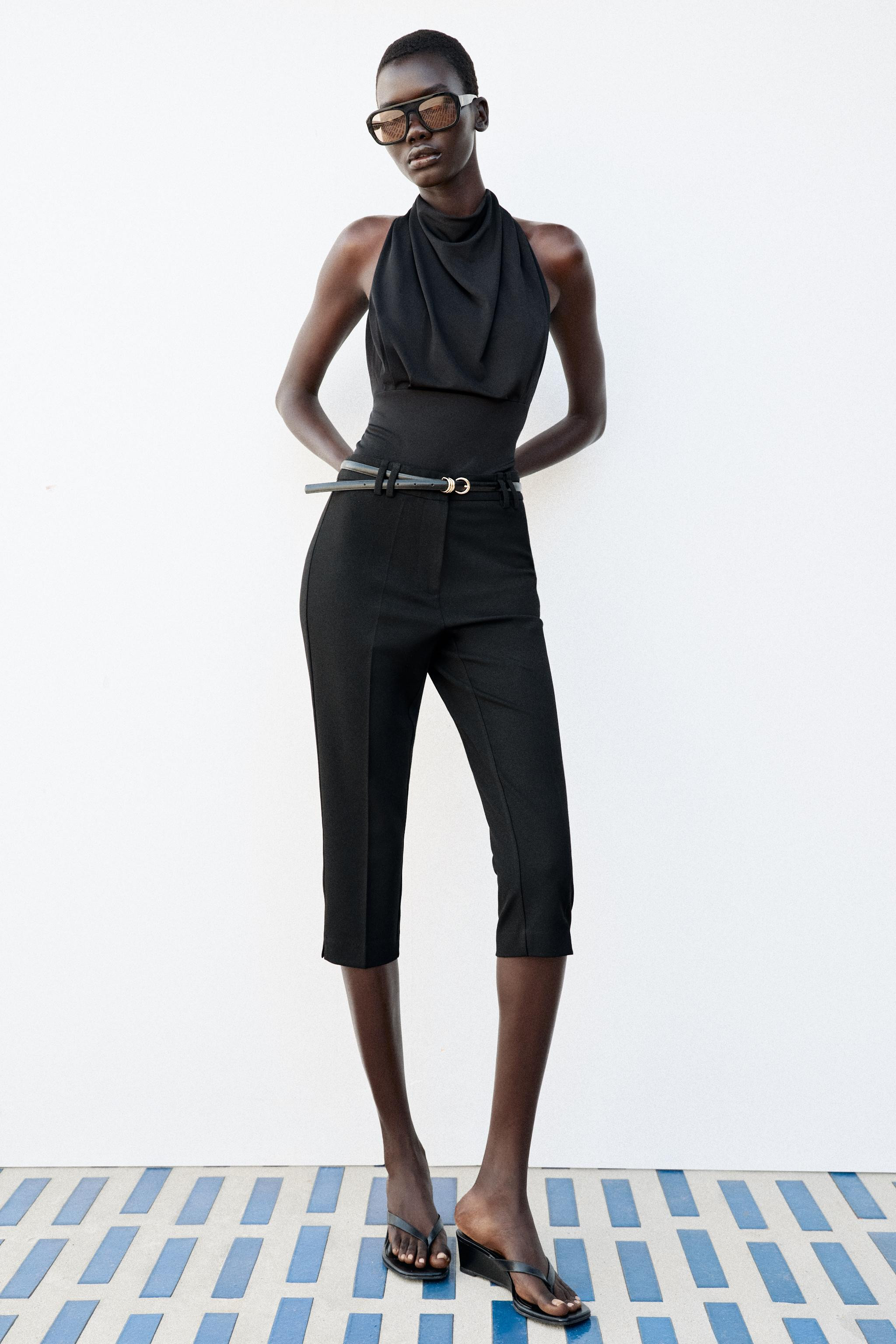 Model height: 178 cmSleeveless top with a cowl neckline. Featuring a straight hem and button fast... | Zara DE