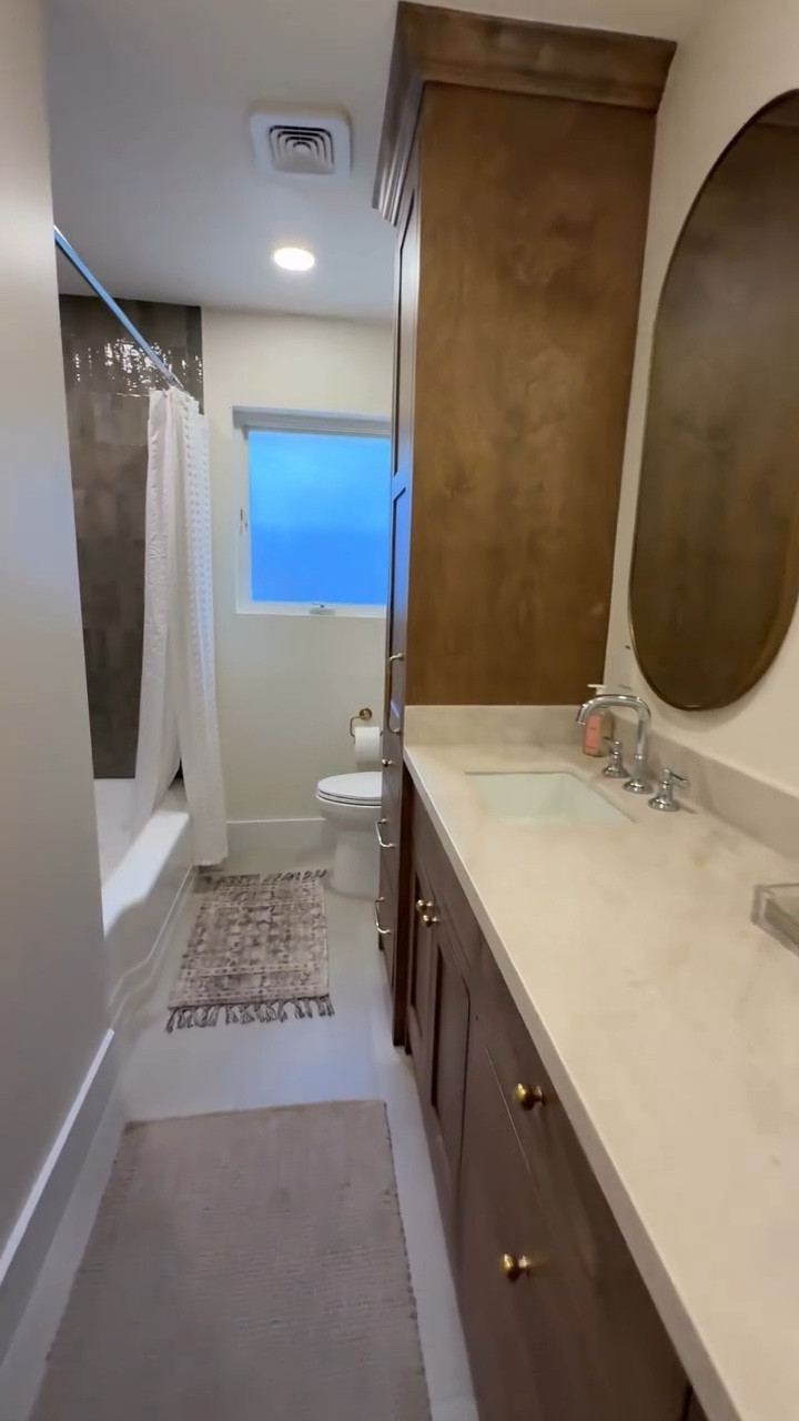 Guest bathroom remodel! Love my Zellige stacked tile shower backsplash, Taj Mahal quartzite countertops, custom maple cabinets, brass hardware and finishes mixed with polished chrome fixtures 🫶#bathroom #bathroominterior #bathroominspo #interiordesign #bathroomreno #homereno #brassandchrome  #classicinteriors #nancymeyersaesthetic #gardenoakshouston #tajmahal #

#LTKvlog #LTKselfcare #LTKHome