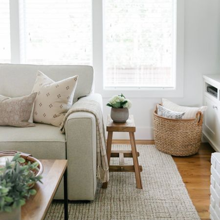 Living room highlights include a Pottery Barn Pearce sectional, Pottery Barn wool jute rug, wood stool, seagrass basket 

#LTKFind #LTKhome #LTKstyletip