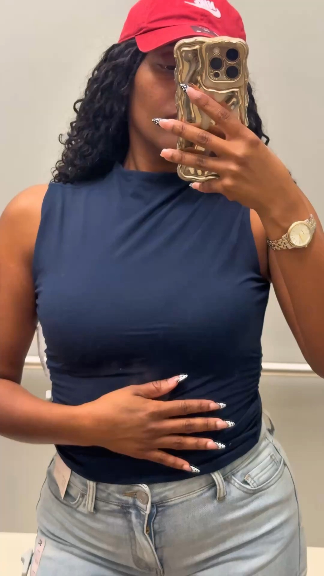 Make it high neck, but not turtleneck and sleeveless, which equals perfect for the spring and summer months.

This shirt came in a multiple shades of blue. It is stretchy, but still offers high compression, you can dress it up or dress it down and a pair of perfectly with these jeans shorts as well as then Nike hat. 

I’m wearing this shirt in a size medium  ❤️