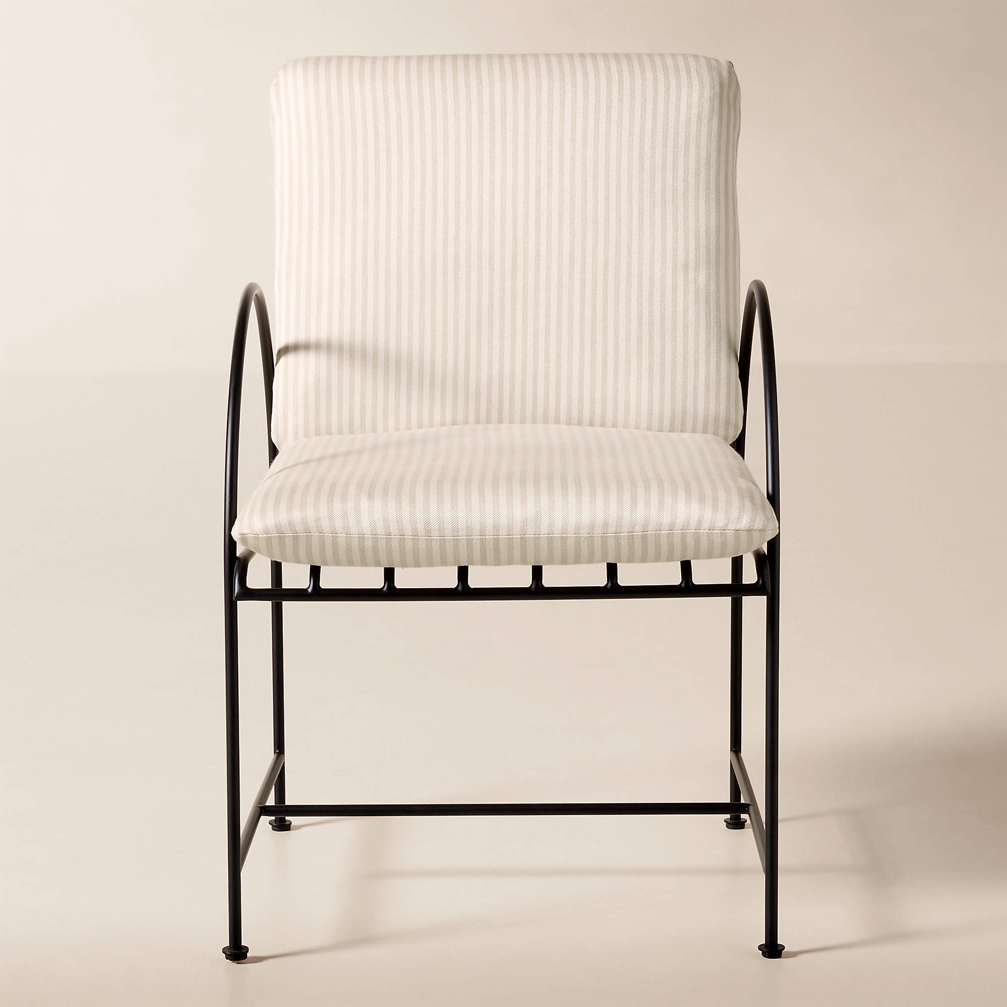 Costa Black Metal Outdoor Dining Armchair with Natural And White Striped Sunbrella Cushion | CB2 | CB2