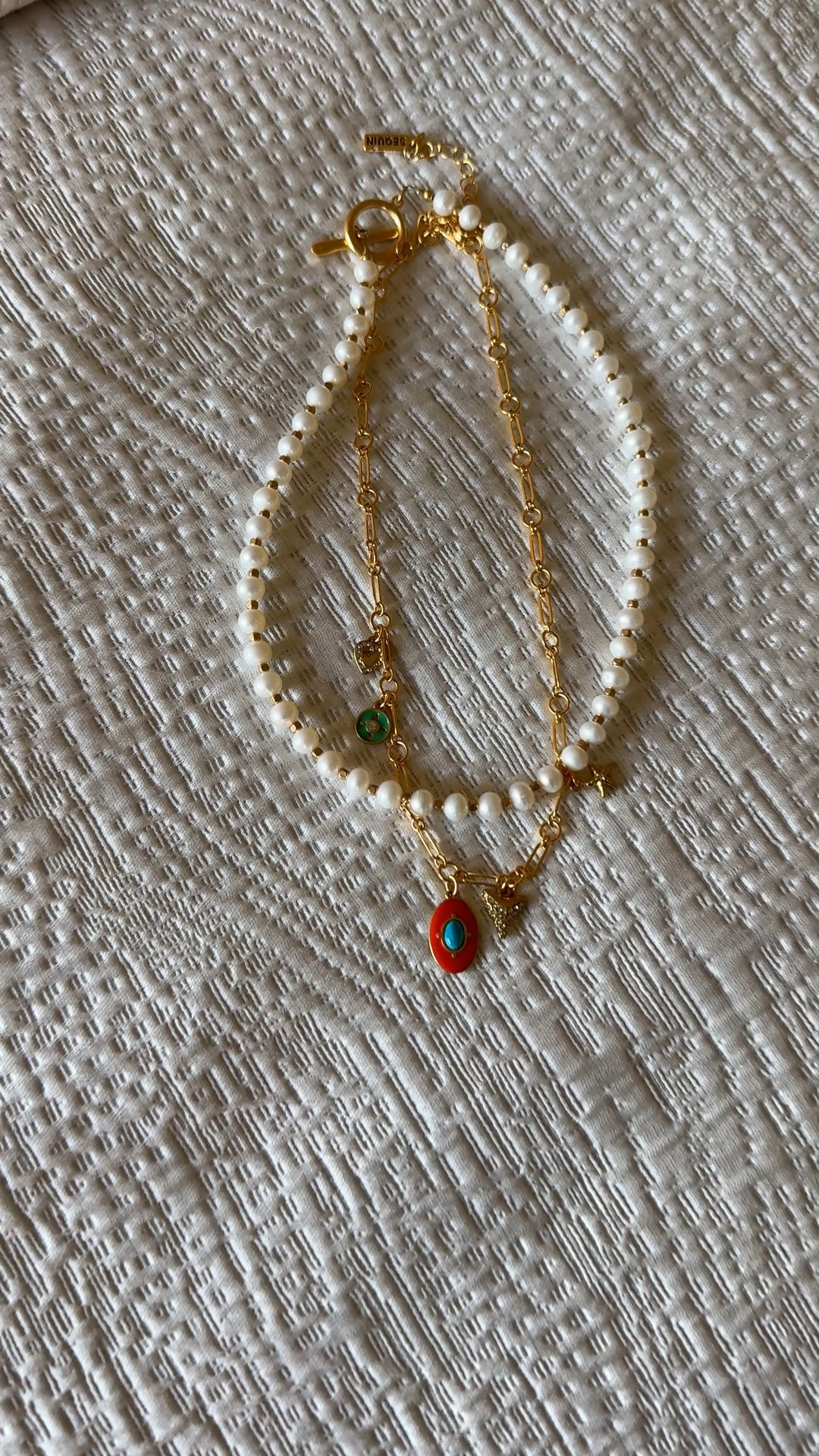 Necklace combo. Pearl necklace and charm necklace. Looks great against a plain white tee or with a button down shirt. 
Code Naomi20 to save  

#LTKOver40 #LTKStyleTip