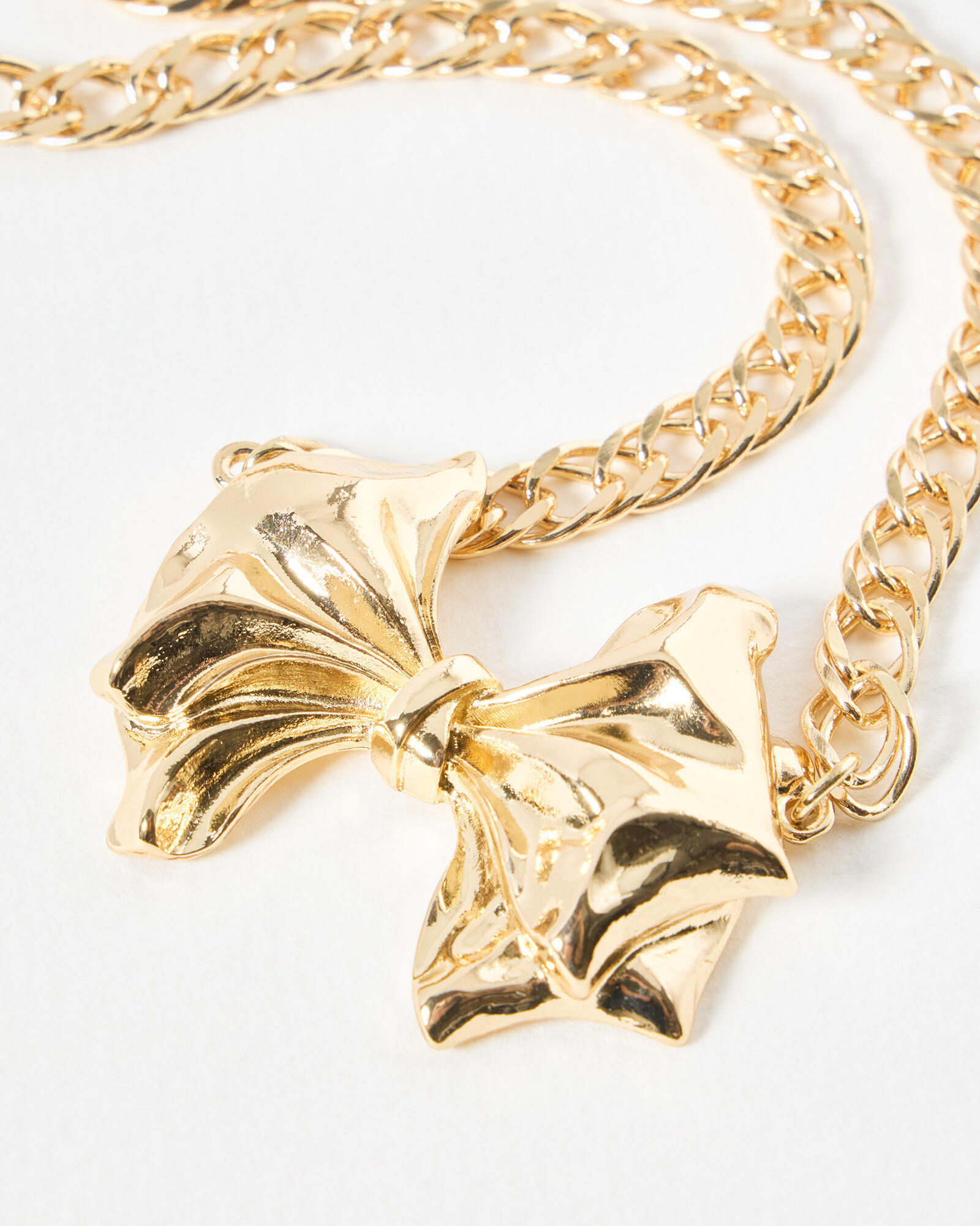Misha Chunky Bow Gold Tone Statement Necklace | Oliver Bonas | Oliver Bonas (Global)