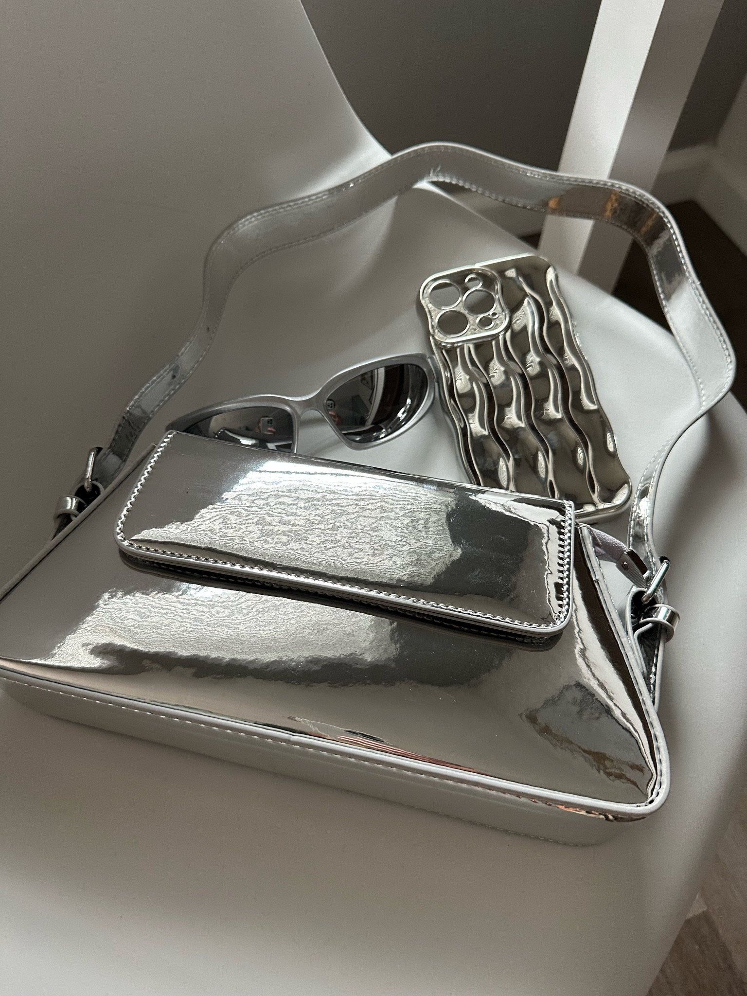 Silver accessories 
Silver sunglasses 
Silver phone case 
Silver purse 


#LTKfindsunder50 #LTKGiftGuide #LTKHoliday