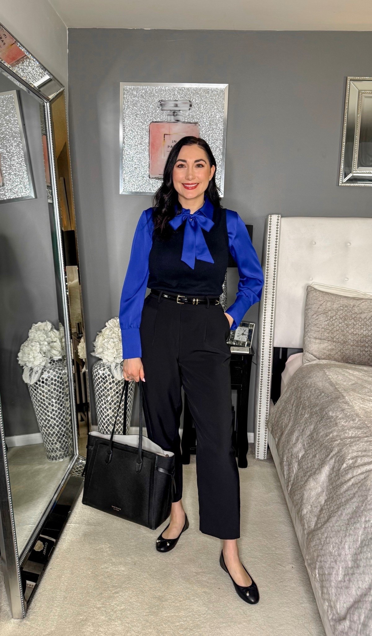 Business casual work outfit 💙🖤

Blue tie neck blouse 
Black sweater shell 
Black pants 
Black ballet flats 
Black tote bag 

Work wear 
Office outfit 



#LTKWorkwear #LTKSeasonal