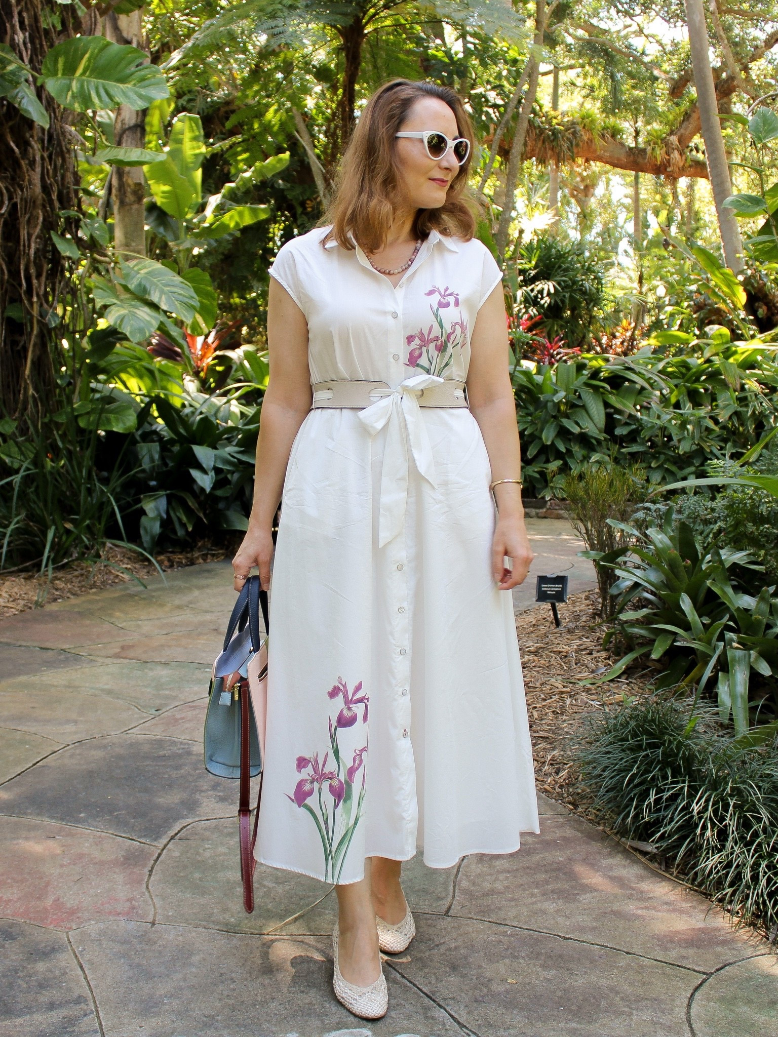 White cotton shirtdress with pockets with floral print. It runs a tad big but I am wearing my normal small size. 

Summer outfit. Summer dress. Dress with packets.