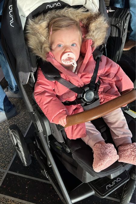 En route to NYC 
.
Baby parka - baby coat - baby jacket - uggs - baby clothes - velour sweatsuit - velour outfit - pink outfit - baby girl clothes - winter clothes - hair clip - Nuna - stroller - airport look - travel look - travel style - baby travel 

#LTKbaby