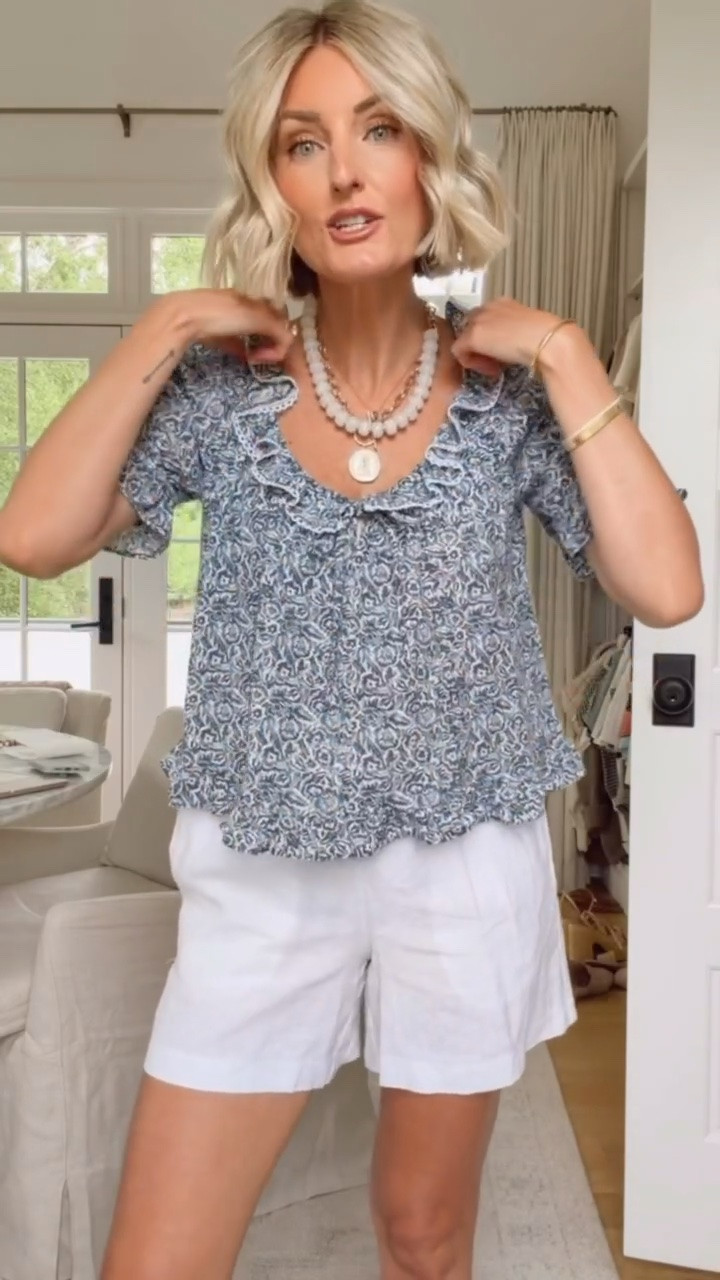 How feminine and fun is this ruffle printed blouse! Cannot believe how affordable this look is! If you want to add some fun personality in with these shorts then this blouse is the perfect option. Wearing XS in both! Loverly grey, summer outfit ideas, summer style, how to style white linen shorts, target finds, quince finds, affordable fashion womens

#LTKootd #LTKSeasonal