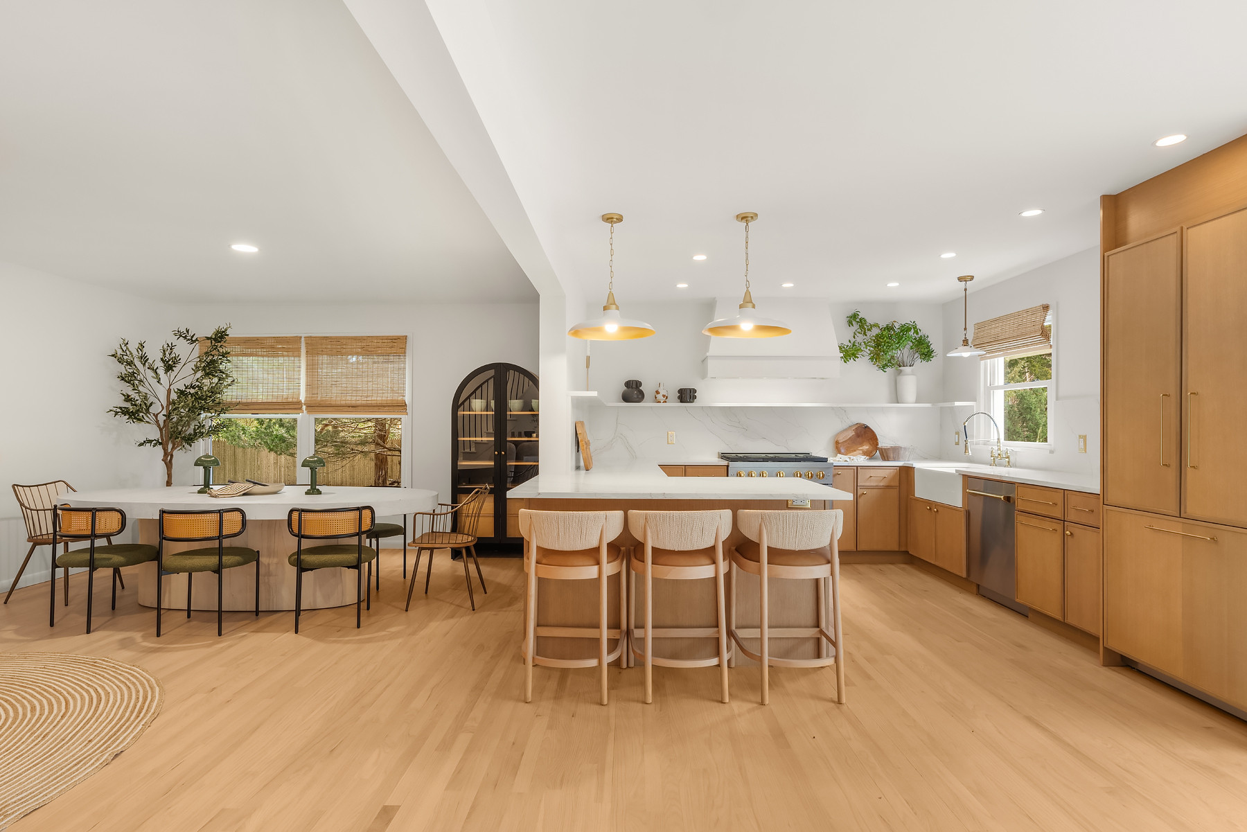 Kitchen and dining view with warm wood cabinetry, simple lighting, and natural textures throughout. Linked exact and similar pieces below.

#LTKHome #LTKSaleAlert