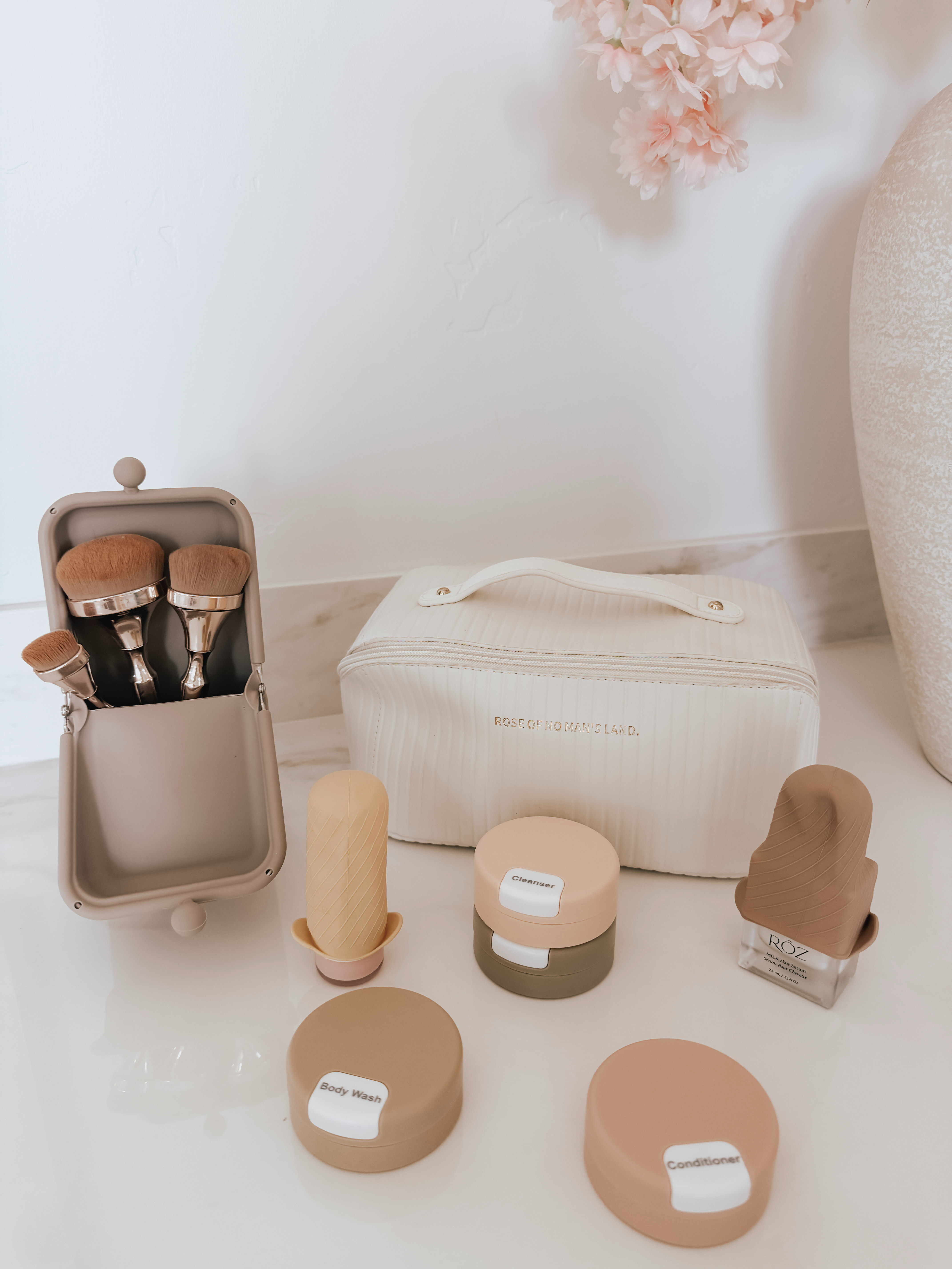 The little travel finds that somehow make the biggest difference. A mini neck massager for long flights + travel days, an everyday makeup brush cleaner spray to keep everything fresh while traveling, and the travel toilet drops because if you’re sharing a hotel room with family or your significant other… you already know,  little things that just make trips easier! 

 #LTKTravel