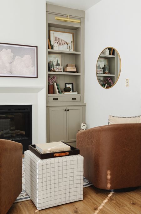 Our primary bedroom fireplace nook with custom built-ins and curtains!

#LTKhome