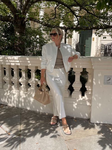 White & beige summer outfit - zara white bomber jacket, another version beige ribbed vest top, river island white satin midi skirt, polene handbag & ego Chypre sandals  

#LTKstyletip #LTKSeasonal #LTKeurope