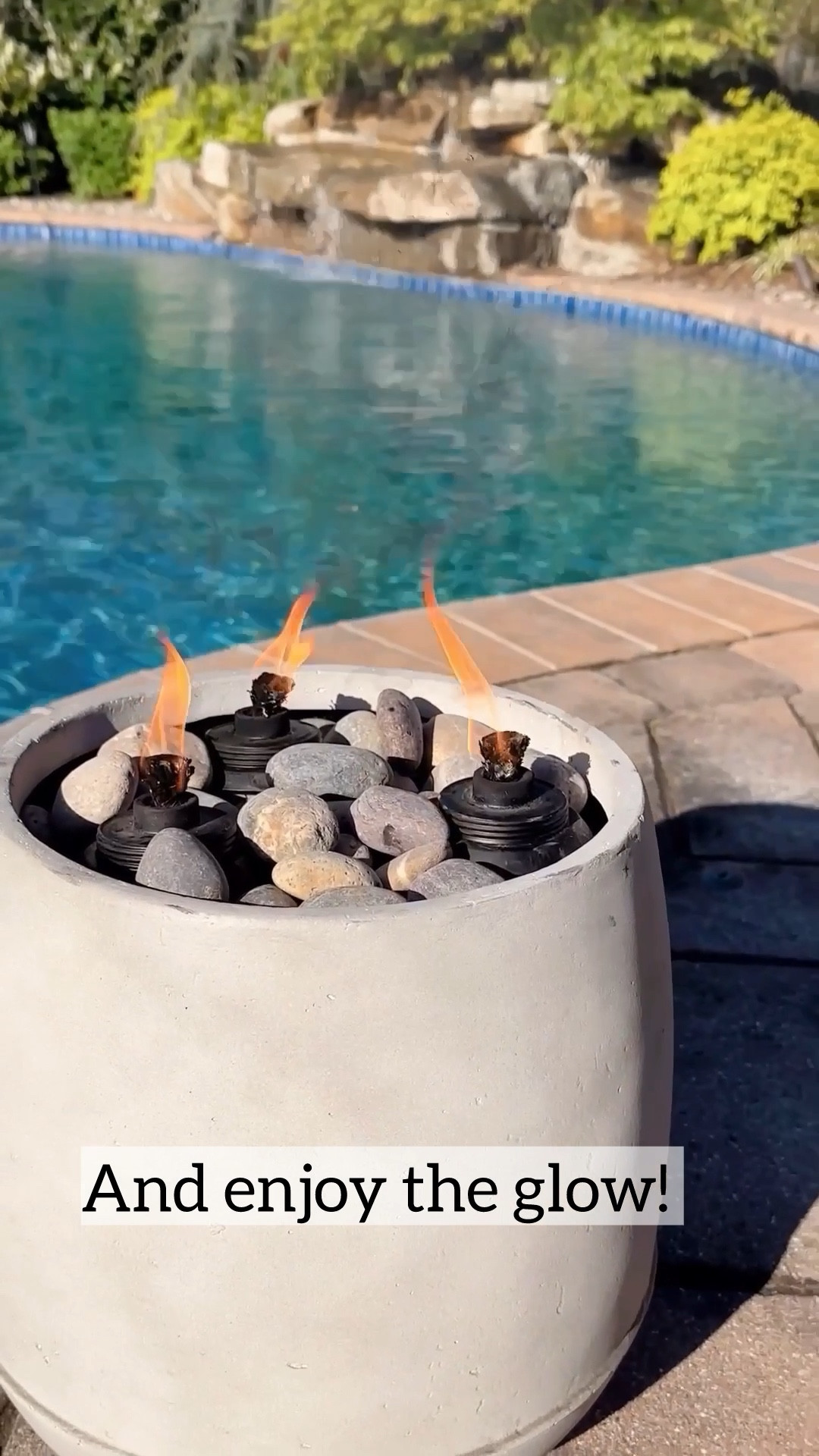 DIY Tiki Fire Bowl 🔥Turn a simple planter into a chic fire feature in minutes—instant resort vibes and it helps keep bugs away.

I always wanted built-in fire features around our pool, but not the cost or installation. This is the easiest workaround—affordable, quick, and honestly looks custom.

What you need:
• Resin planter
• Mulch (for filler)
• Tiki canisters + fuel (I used bug-repellent fuel)
• River rocks
• Lighter or matches

How to make it:
Fill the planter with mulch → add and space out the tiki canisters (I used 3) → cover with river rocks → light and enjoy.

That’s it—an instant glow-up for your outdoor space.

Save this for later—you’re going to want to try it.

#LTKSeasonal #LTKHome