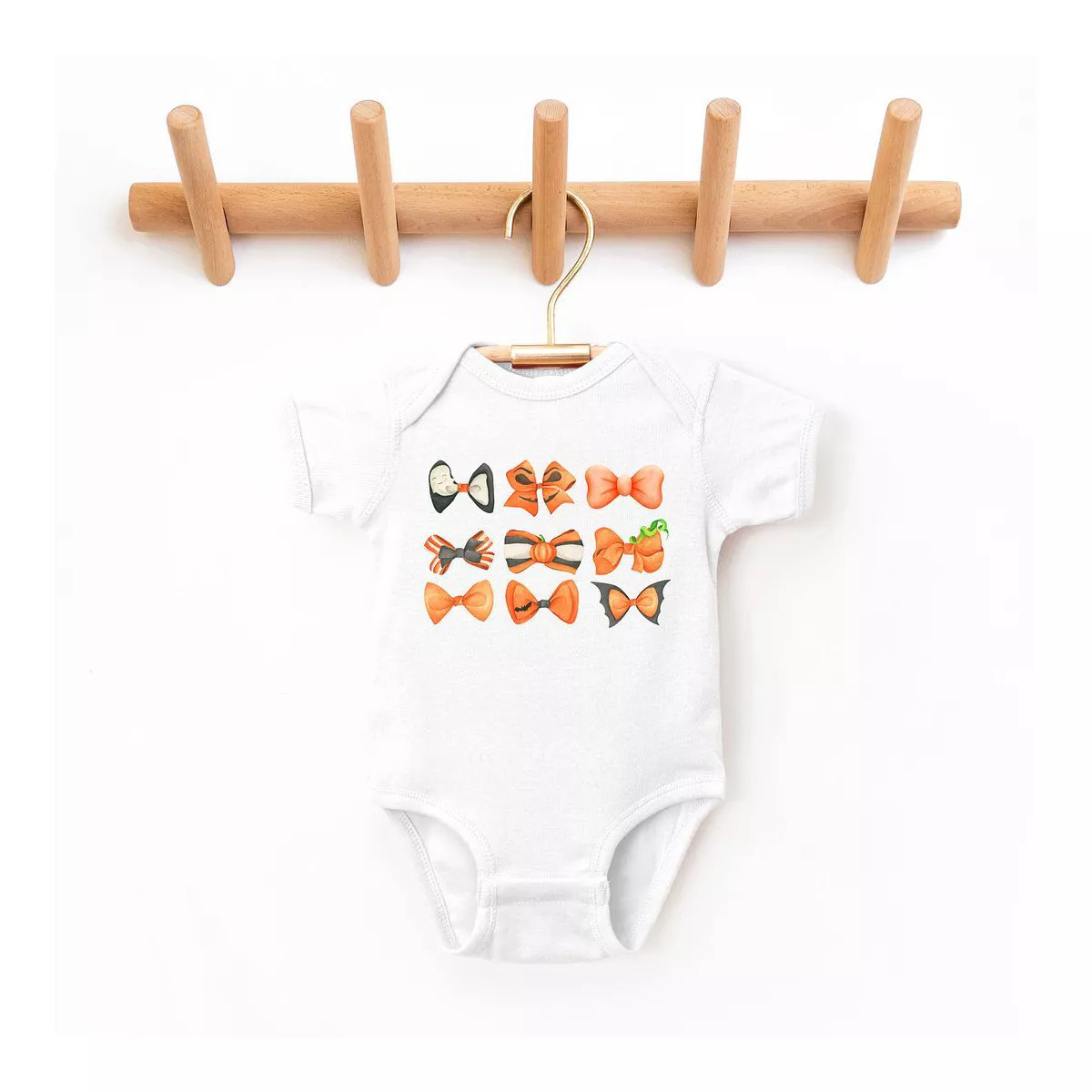 The Juniper Shop Coquette Girl Halloween Bow Chart Baby Bodysuit - 18 Month - White | Target