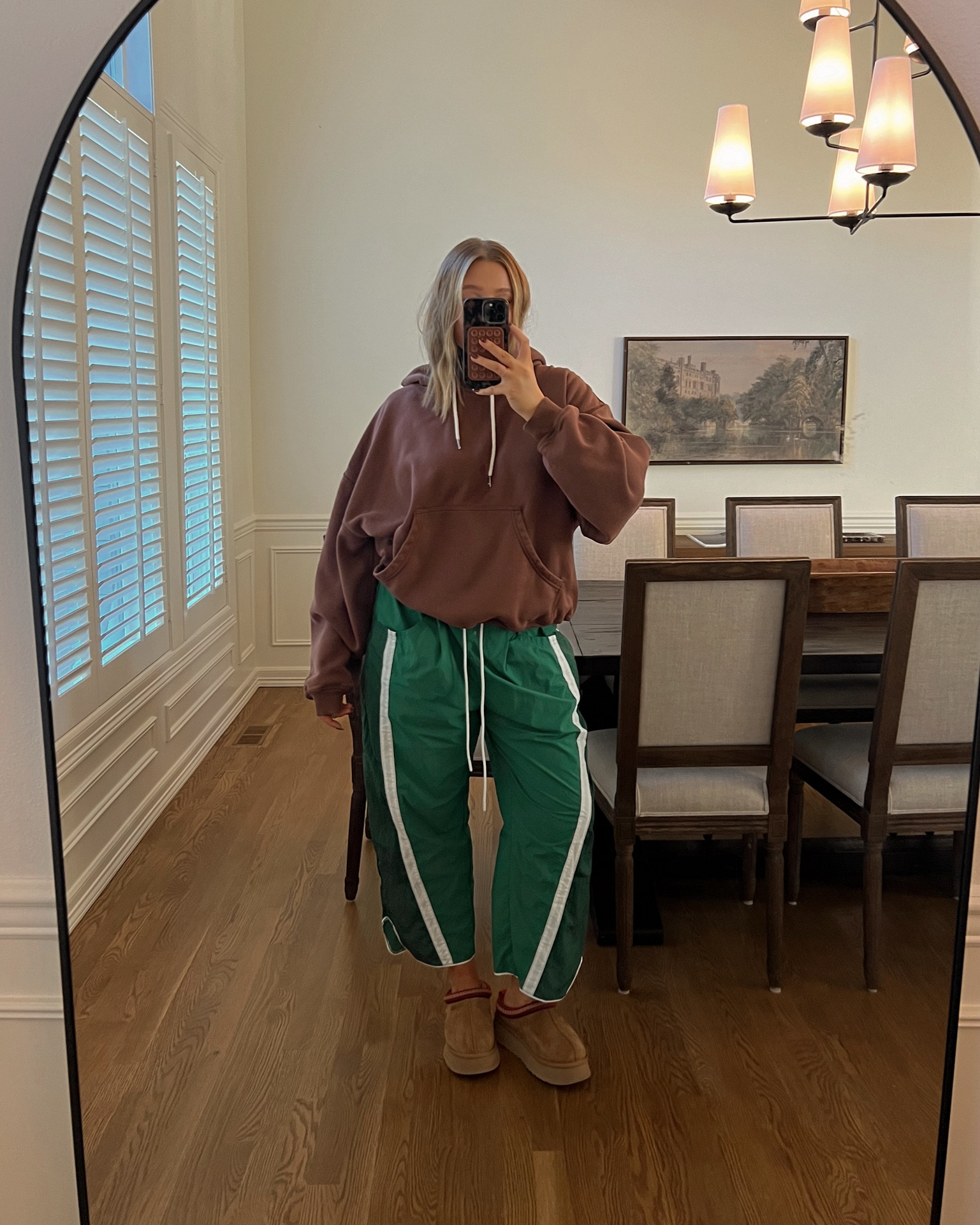 Sweatshirt is true to size with an oversized loose fit I’m wearing a medium! It’s soo soft and cozy inside it’s honestly so good. Pants are also tts M I love the high waist and slight barrel leg. I wore on a flight last month and loved them!! 