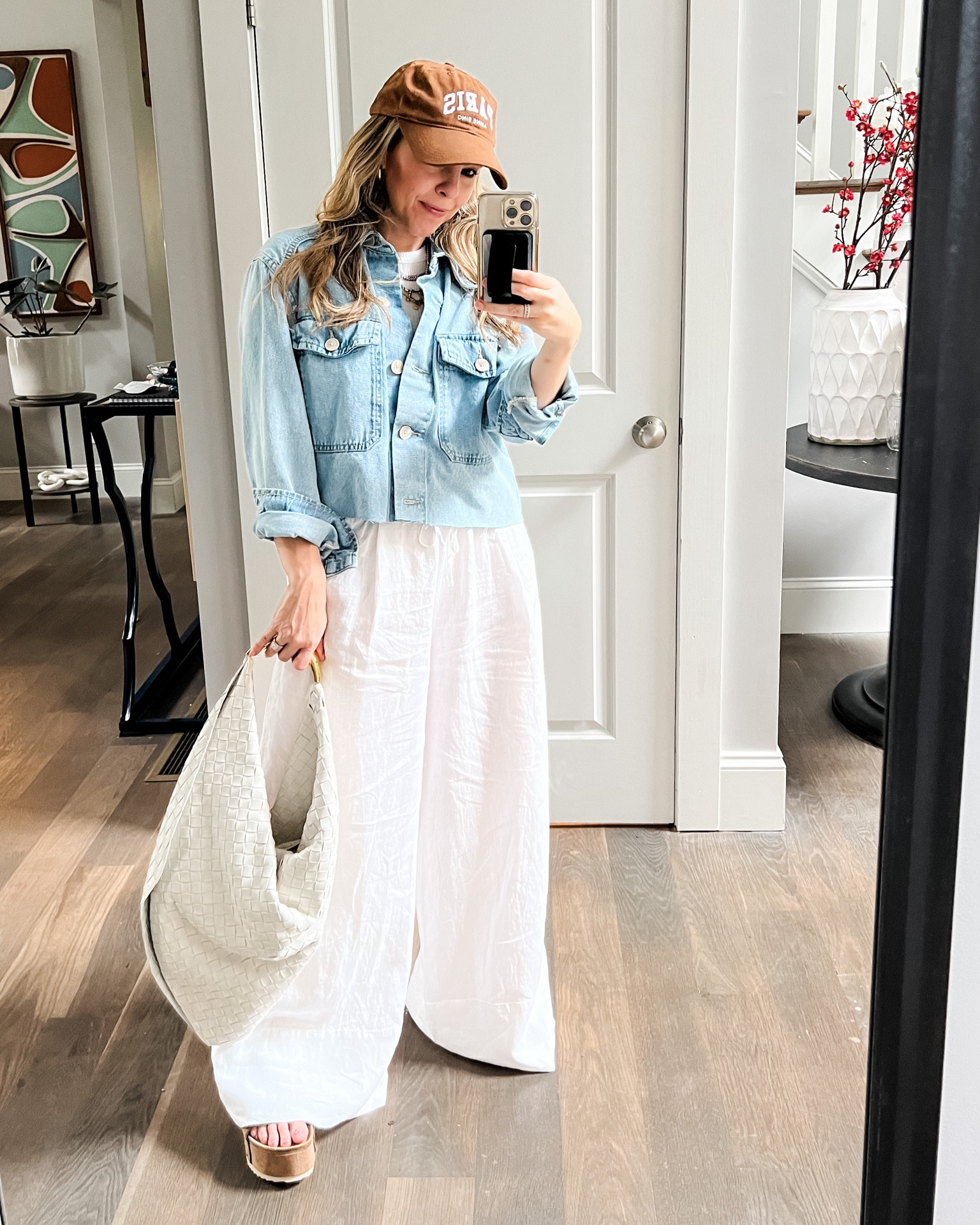 I made my own cropped denim shirt today by cutting off the bottom of this Mango top. Since I had two longer denim tops, this was a great way to get more variety and work my existing items. Pants are from Zara (can’t link in LTK).

#LTKstyletip #LTKitbag