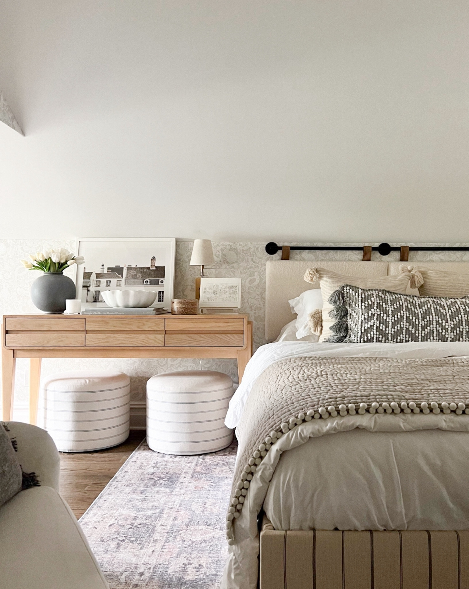 Our attic guest bedroom! The sloped ceilings made it impossible to fit a queen or king bed frame so I installed this wall-mounted headboard to the wall and voila! Super cozy, looks great, and most importantly, it fits!! 

#LTKHome #LTKFindsUnder100 #LTKSeasonal