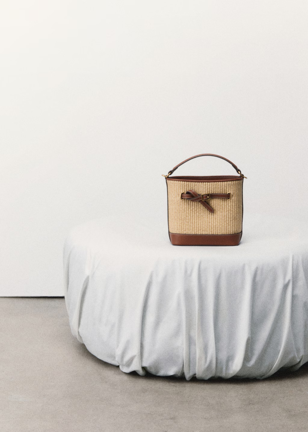 Raffia-effect bucket bag - Women | MANGO United Kingdom | MANGO (UK)