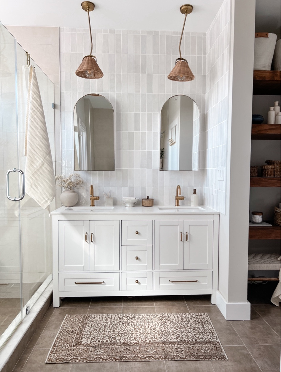 We gave our primary bathroom a mini makeover by upgrading the shower head, faucets, mirrors, light fixtures, and vanity hardware. 

When we purchased this home, this bathroom was very basic builder grade. The first update we made in 2019 was building the floating shelves (previous to the addition of the floating shelves that space was totally empty). In 2020, we added the tiled backsplash behind the vanity. But some this this space still felt incomplete. 

With this upgrade I am now totally loving this space. In a perfect world, we would replace the vanity entirely but for now I’m happy with the hardware change. 

Just your reminderthat home takes time! 

#LTKhome