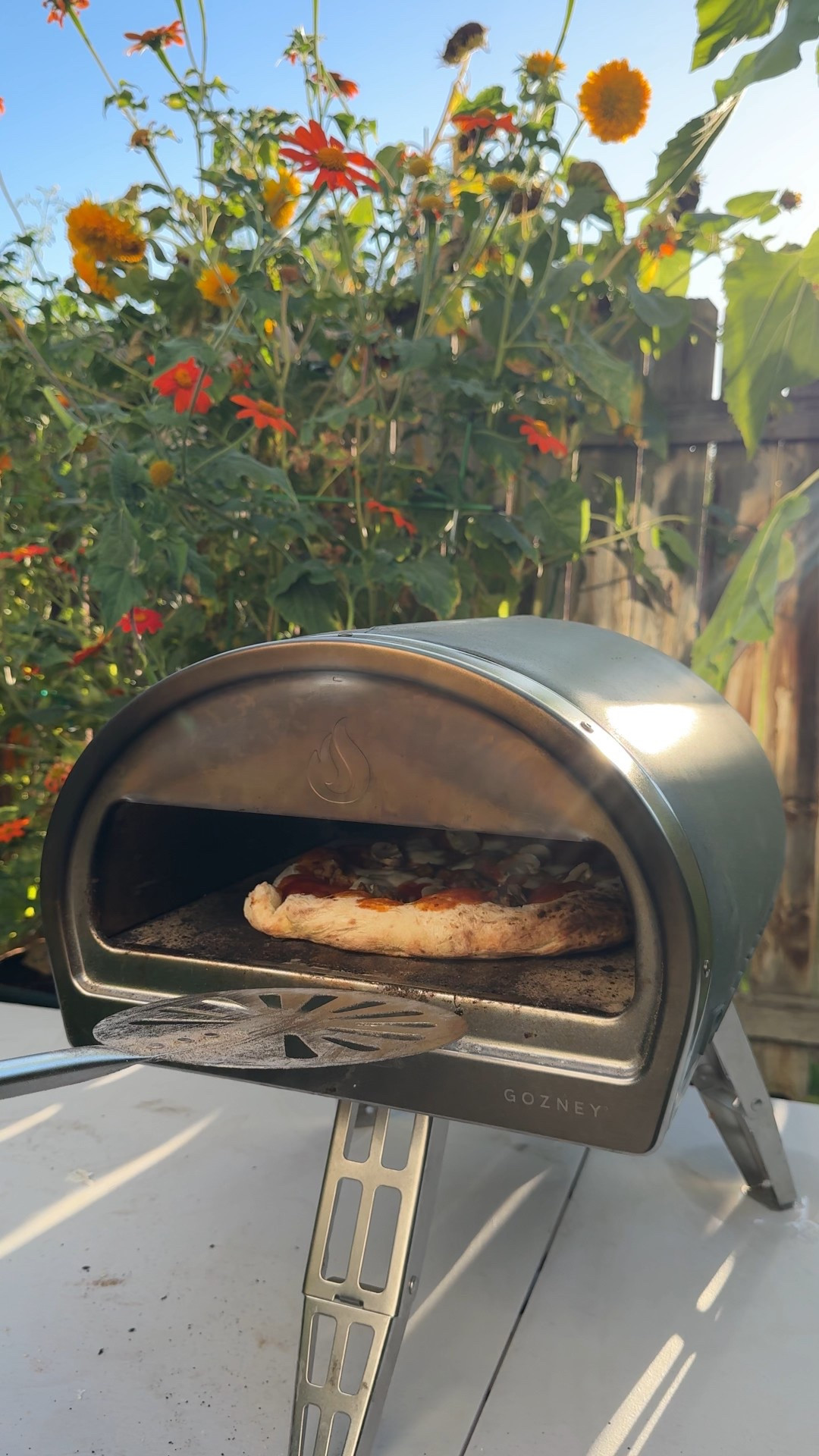 My Gozney pizza oven. Makes 1 pizza at a time (they also have ovens to make 2 at a time). When we aren’t using it, we just keep it in our shed by our grill.