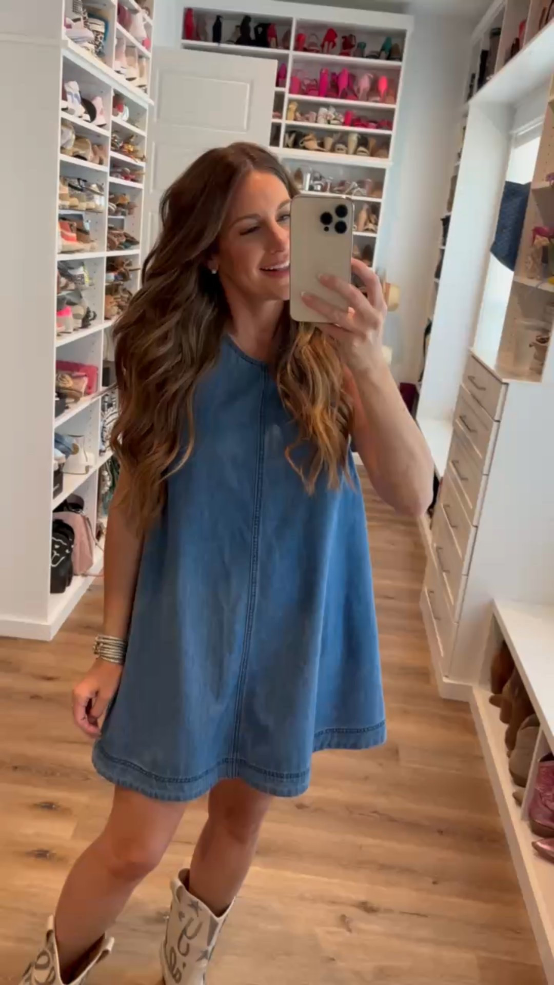 In a medium flowy cutout back denim dress, metallic design ankle cowboy boots and accessories- fits tts.

#LTKSeasonal #LTKFindsUnder50 #LTKStyleTip