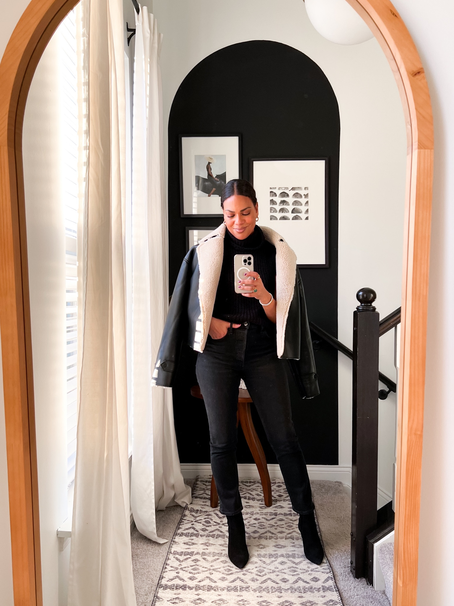 Evereve fleece bomber jacket/fleece air force jacket. TTS but size up for even more room. Paired with black turtleneck black straight denim and sock booties 